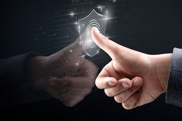 Cybersecurity expert monitoring identity-based access on digital dashboard for a secure enterprise network.